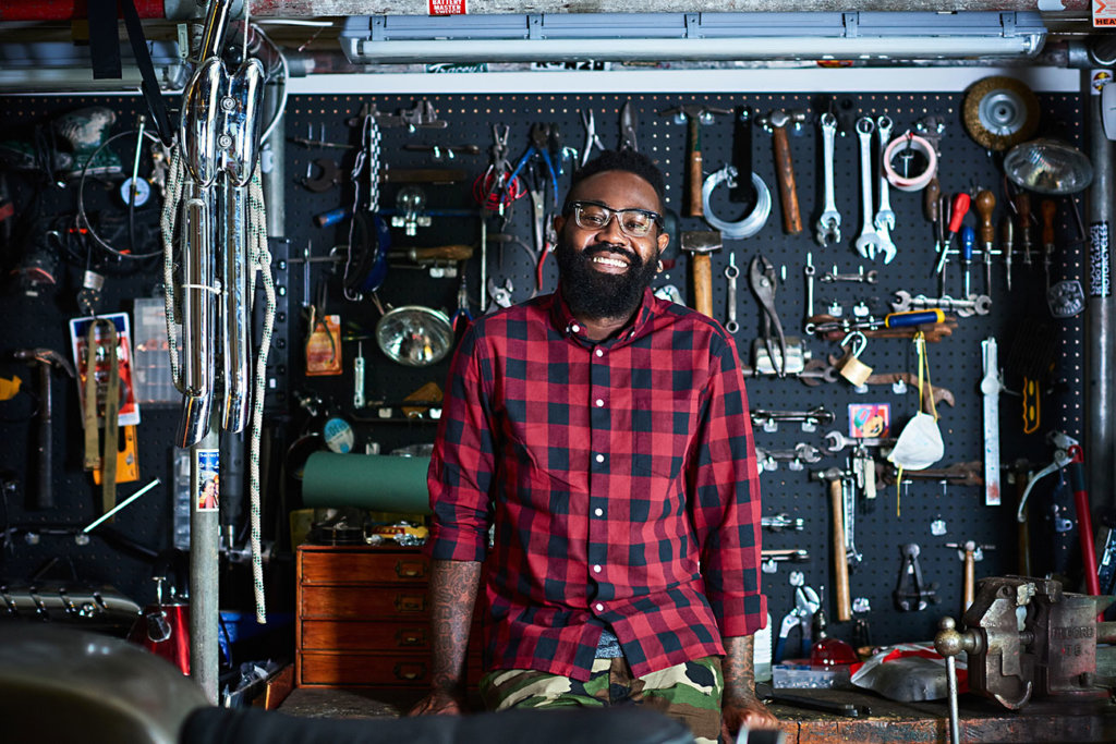 Owner in motorcycle workshop.