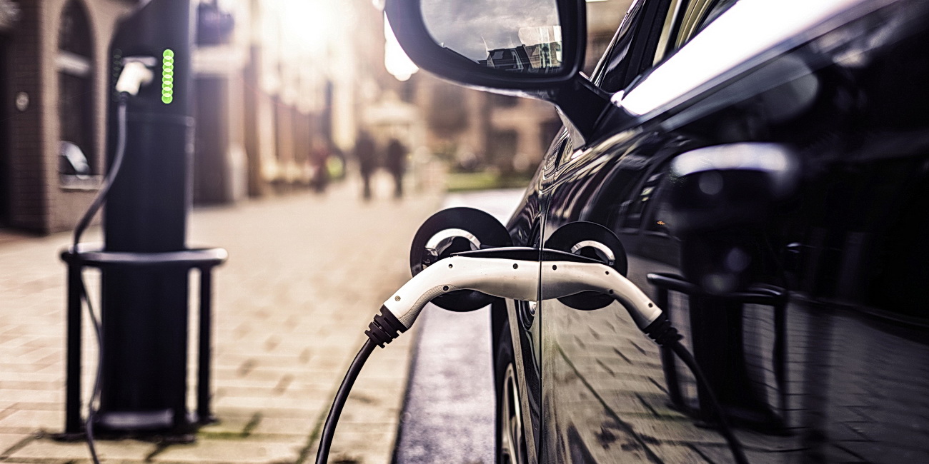 Electric Vehicle at charging station in UK Street