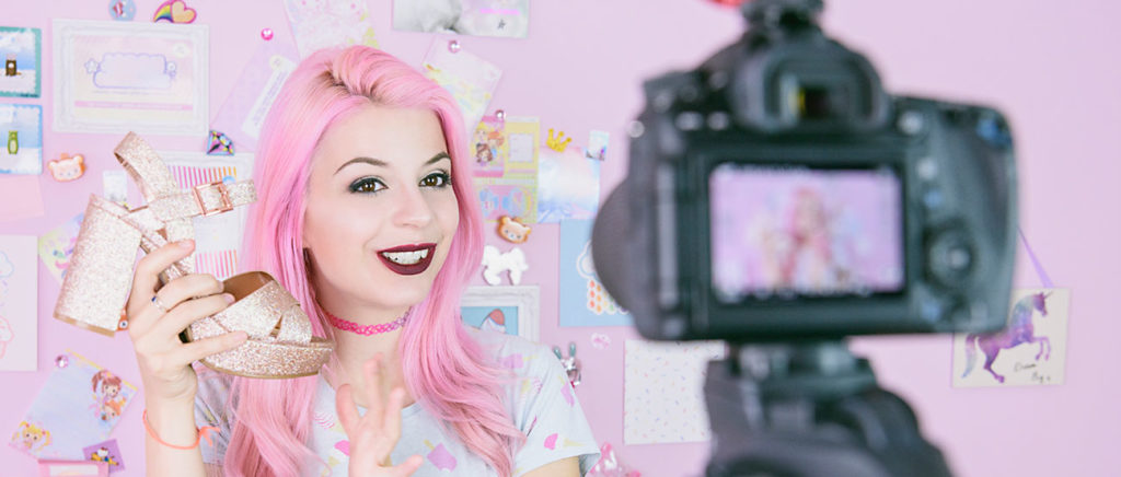 Female vlogger making social media video about fashion shoes for the internet