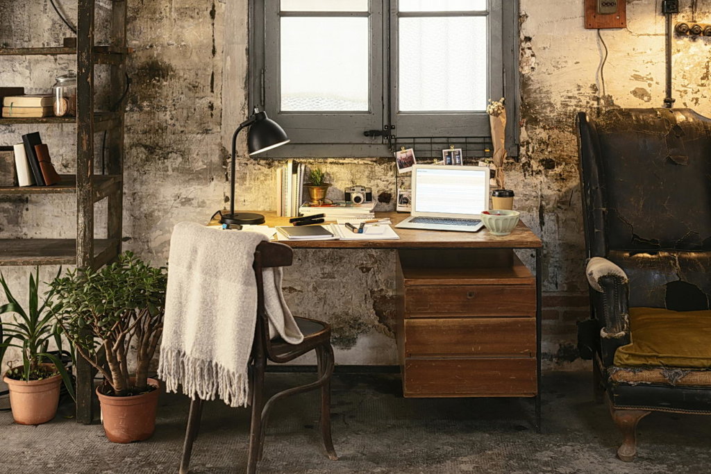 Old desk with laptop in a loft