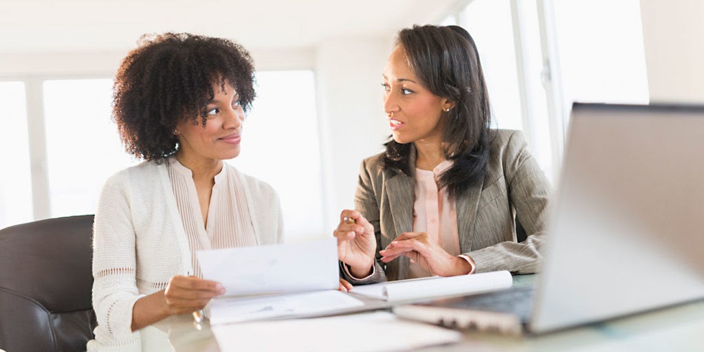 African American tax preparer consulting with a African American professional