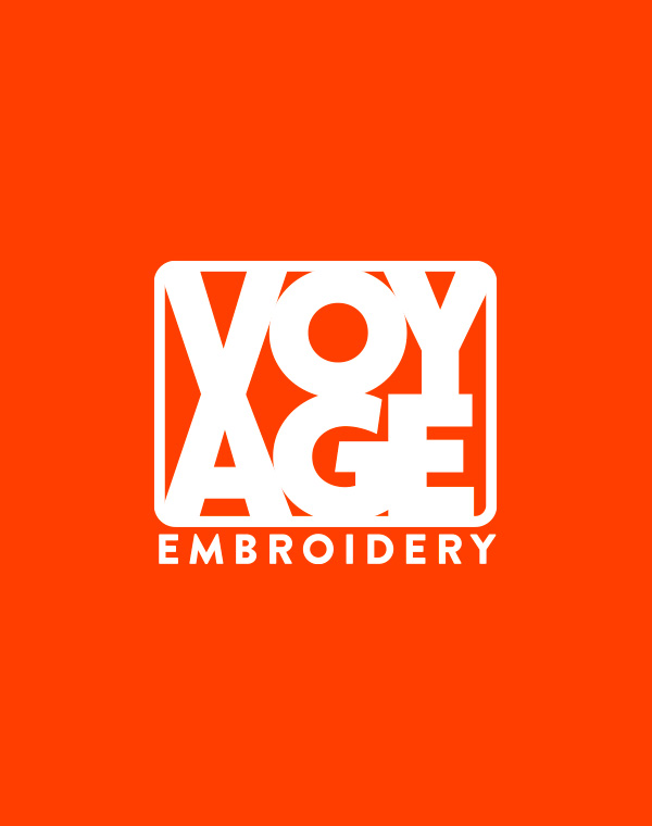 Red background with white voyage embroidery logo on it
