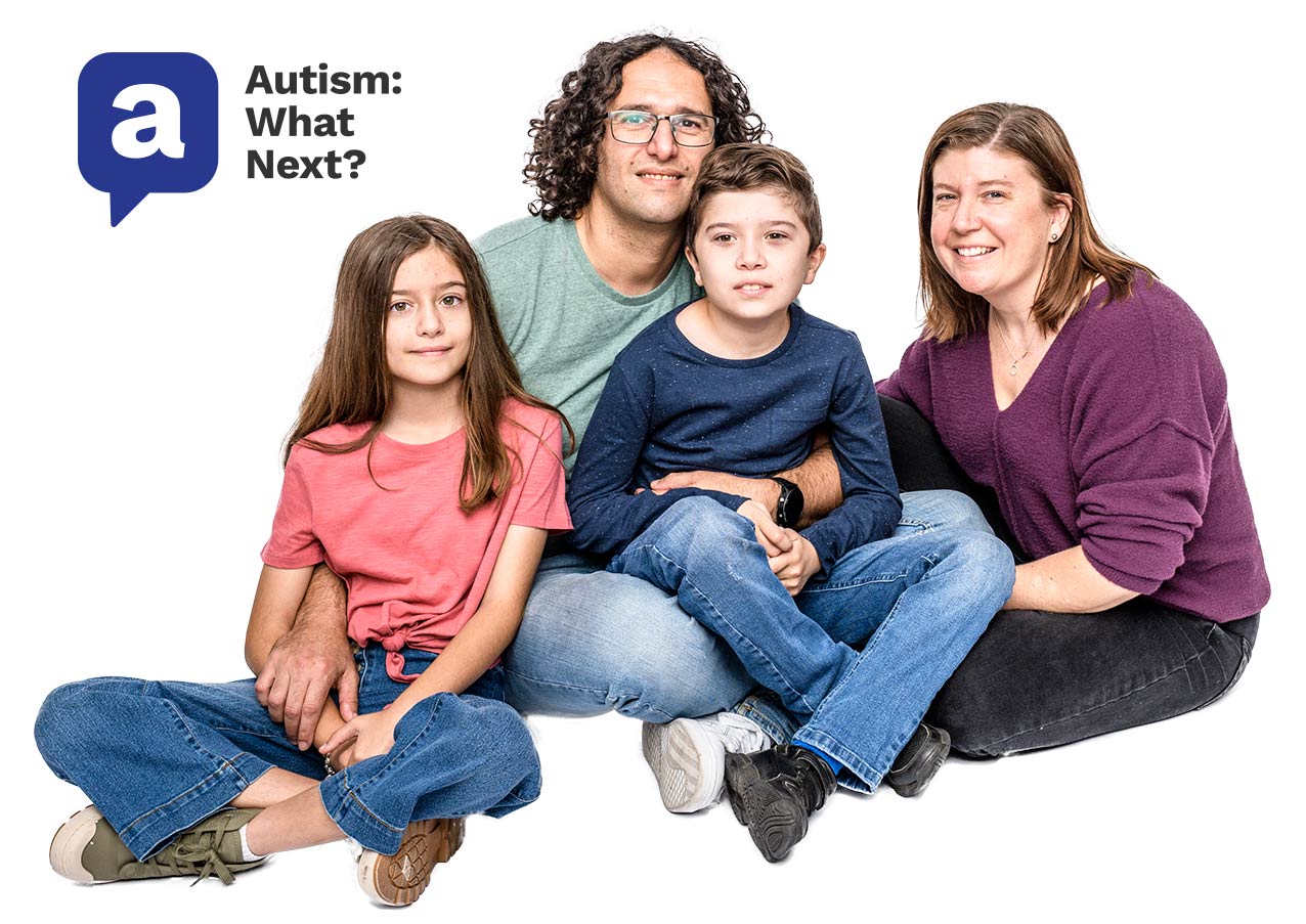 family sitting on the floor, mum, dad, some with autism and daughter