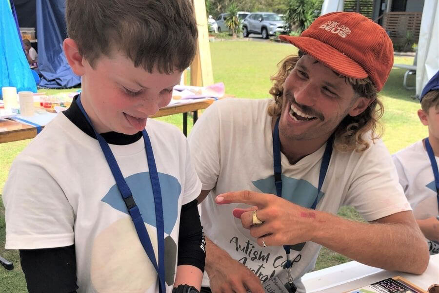 Camp councellor with young boy