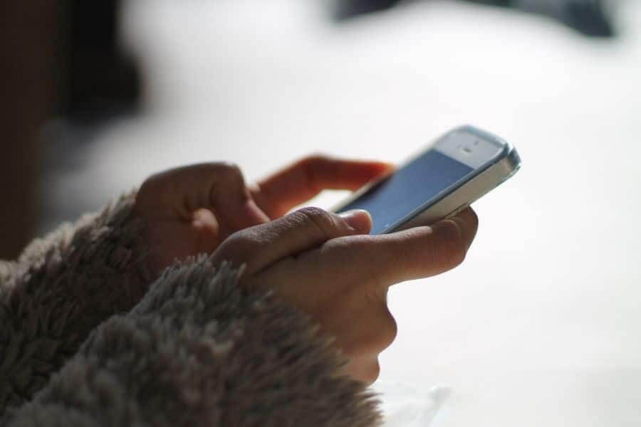 Hands making call on mobile phone