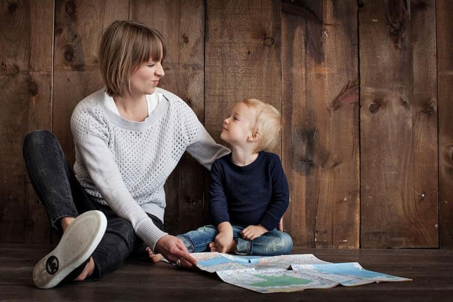 Toddler with mum reading a book