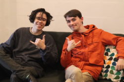 two young autistic adults sitting together
