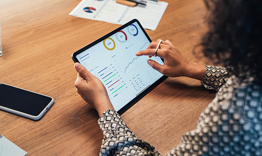 Ipad tablet showing analytics reports.