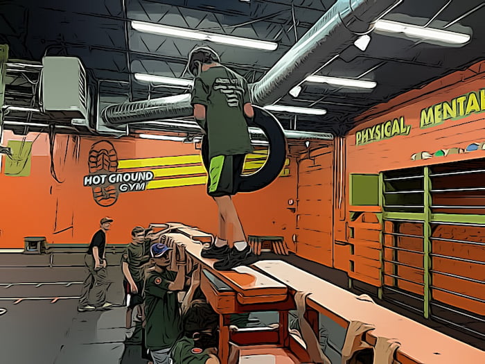 the guy with the wheel is walking on the board