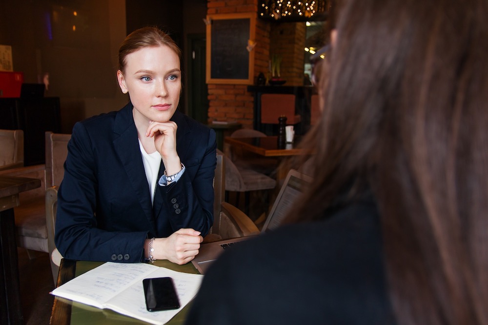Man shaking hands in team meeting