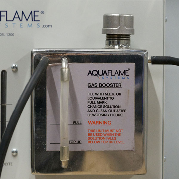 A gas booster being used on an Aquaflame machine