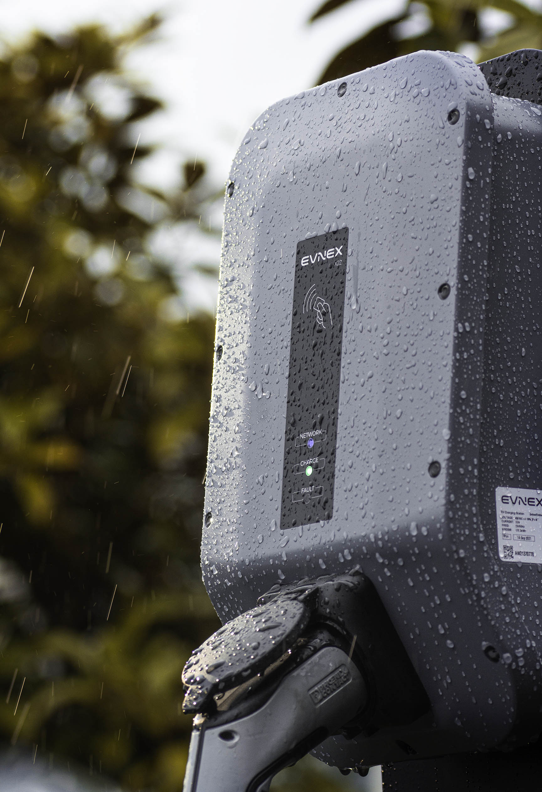 An Evnex smart EV charger in the rain.