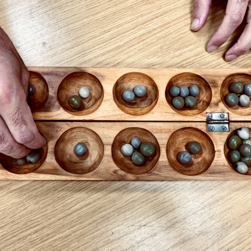 Two wooden trays with stones.