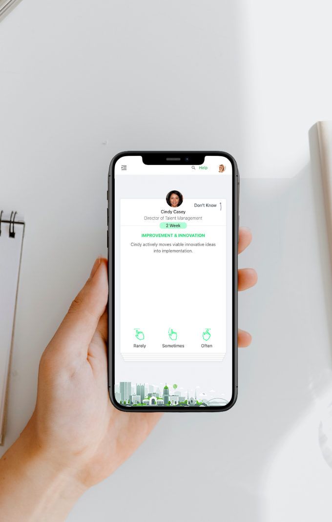User holding an iPhone displaying Rhabit habit swipe card.