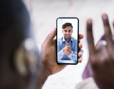 Man uses sign language on a video call