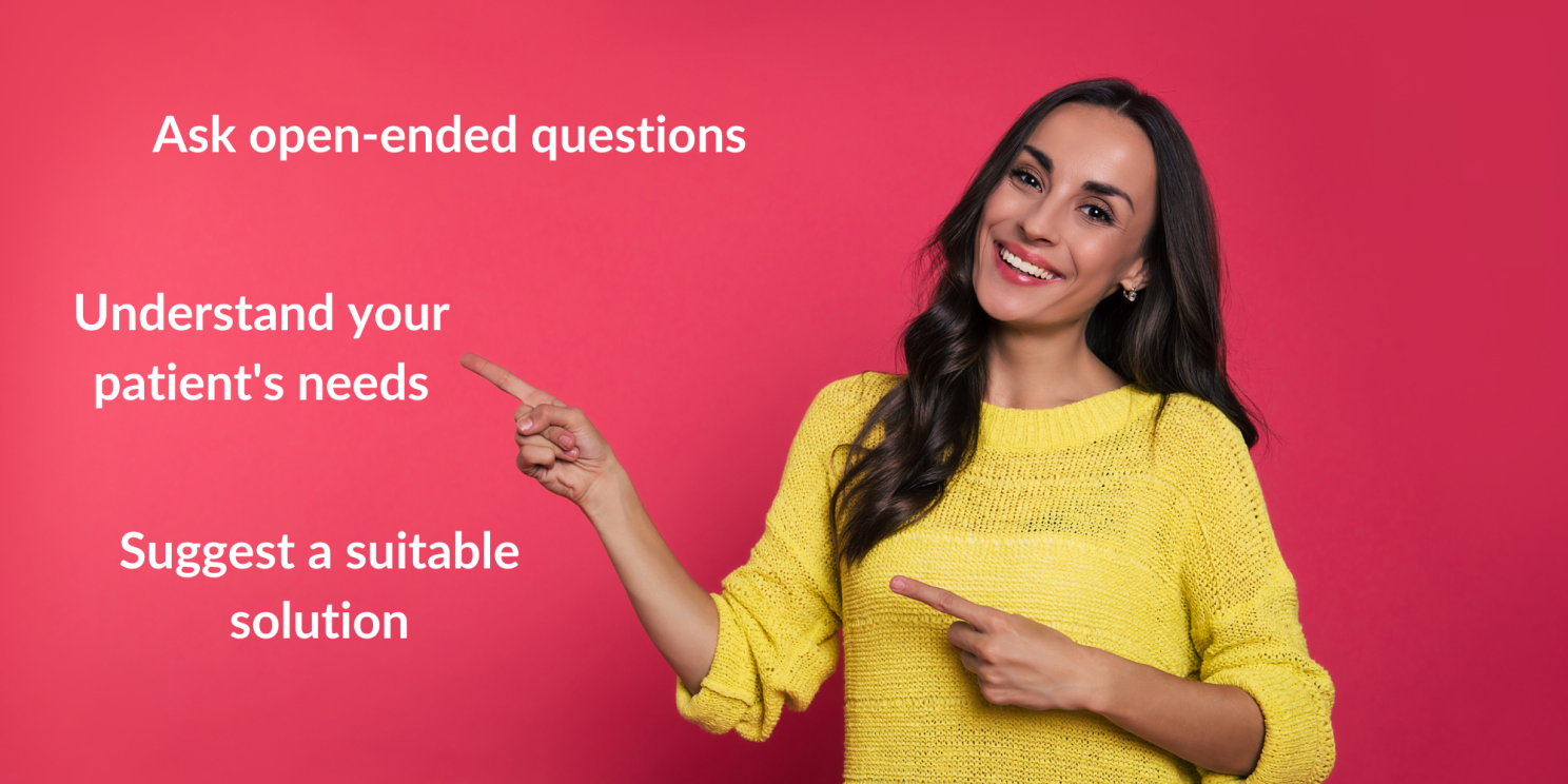 The woman smiles and I point with a finger at the three phrases. "Ask open-ended questions", "Understand your patient's needs", "Suggest a suitable solution".