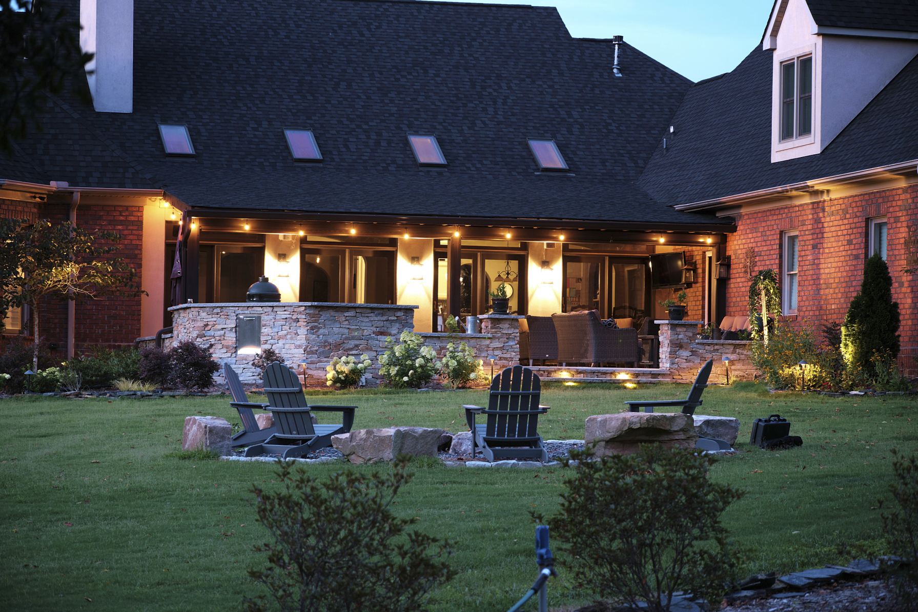 An outdoor kitchen and fireplace