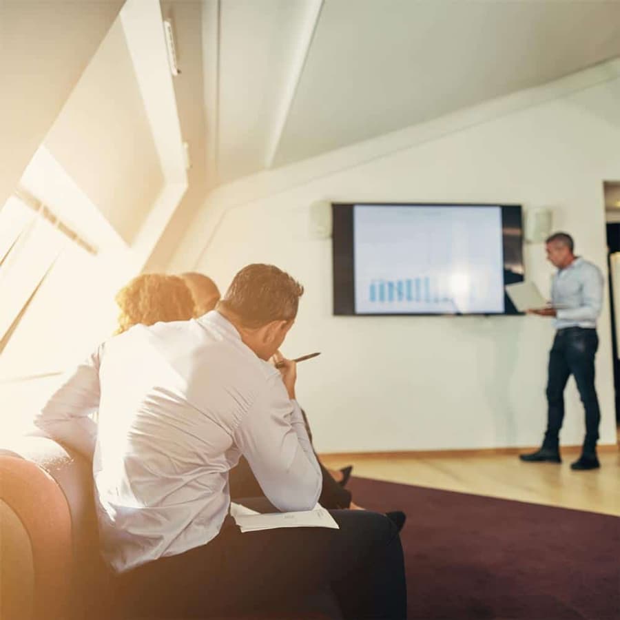 Man presenting to a team.