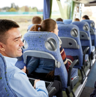 group of happy passengers in travel bus