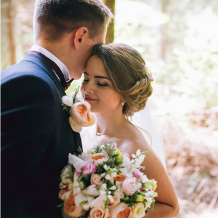 Bride and groom with flower