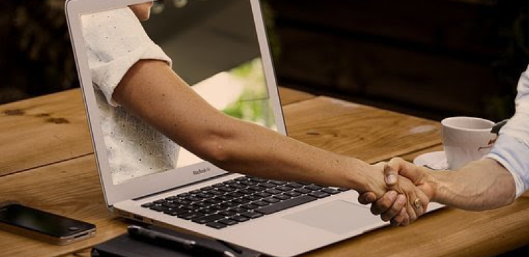 Two people shaking hands.