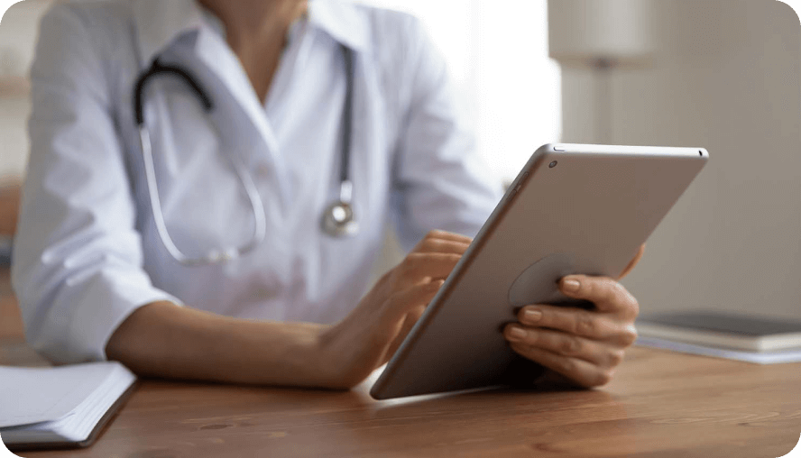 A doctor using a tablet.