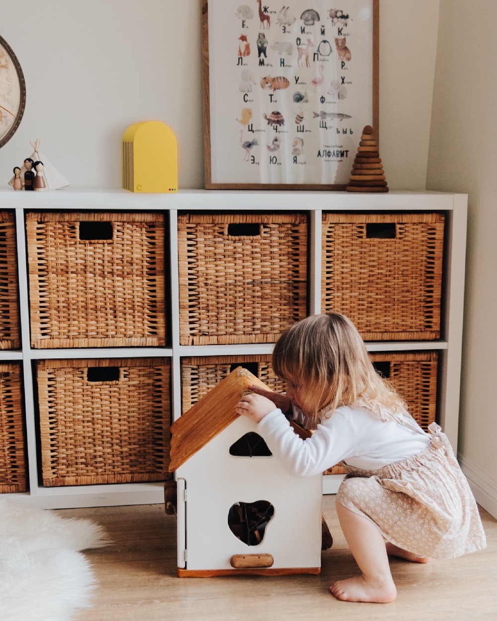 Girl with Claire on a bookshelf.