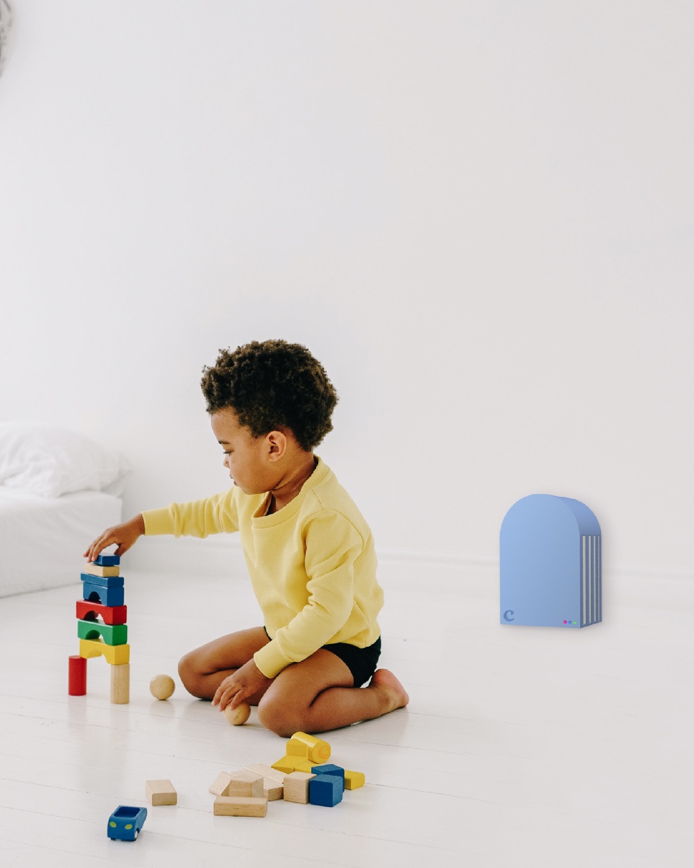 Boy playing with blocks in front of Claire