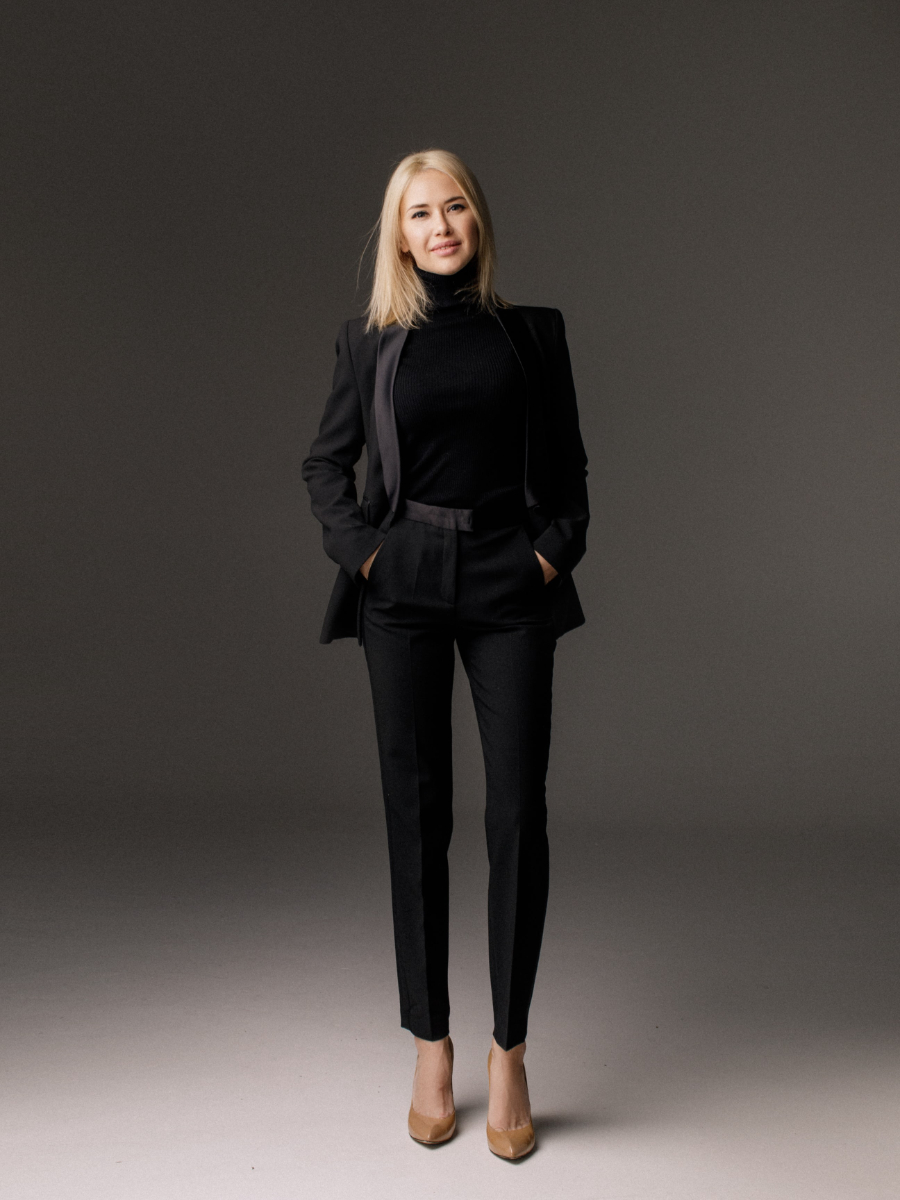 Young woman in black long sleeve shirt and black pants
