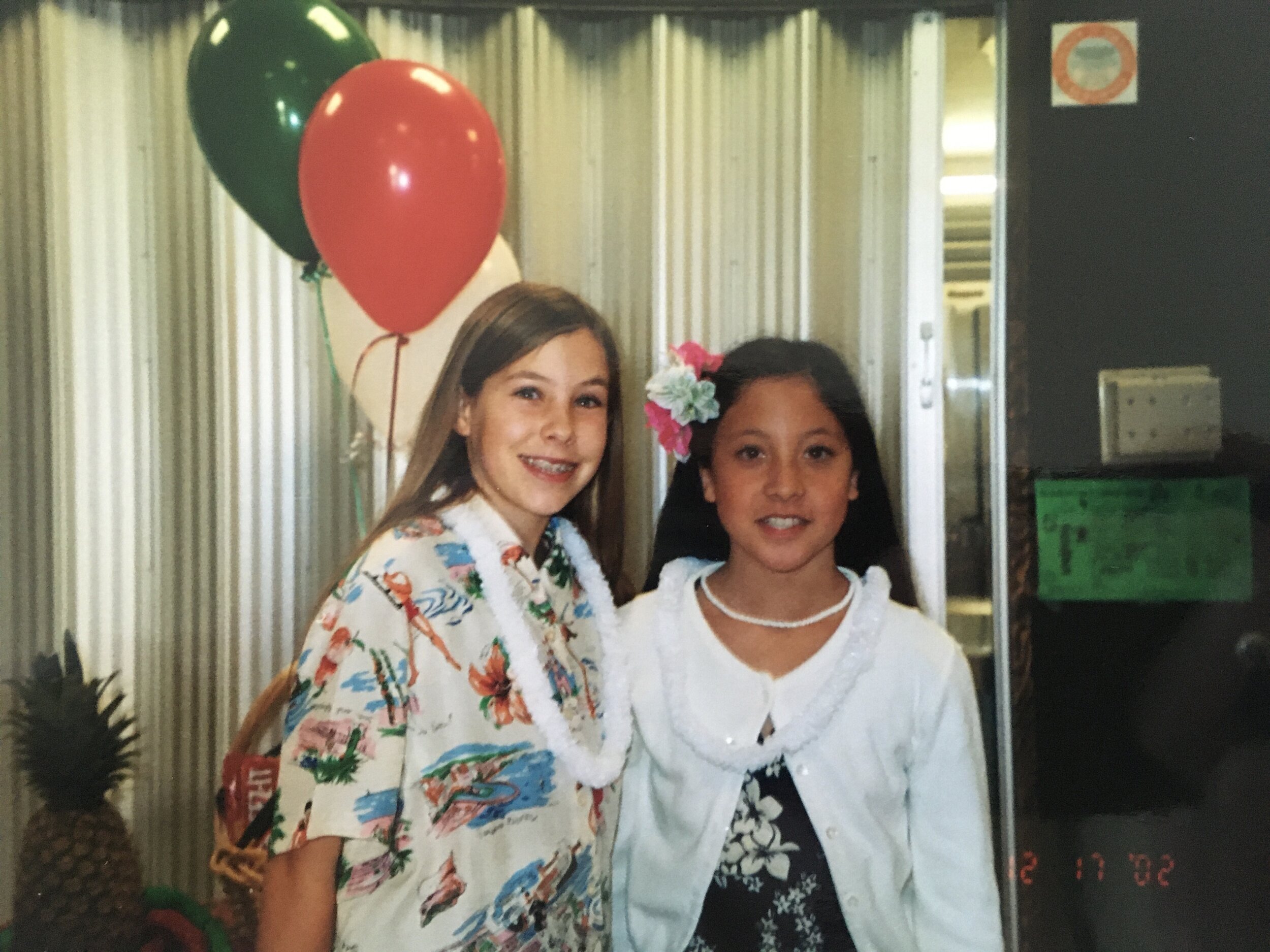 My best friend and me. We were all made to dress up for our “Hawaiian-themed” 6th grade graduation at our 99%-white elementary school.
