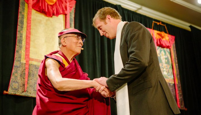 Jake receiving the Unsung Hero of Compassion award from the Dalai Lama, 2014