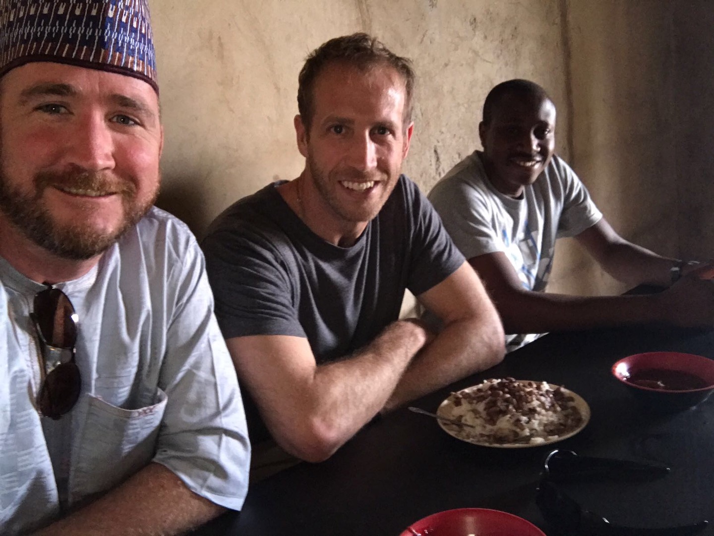 Jake enjoying a meal with the Nuru team in northeast Nigeria, 2018