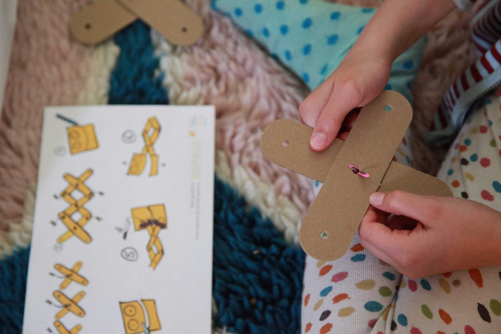 A young maker building an Art Machine using the FutureMakers Printed Guide.