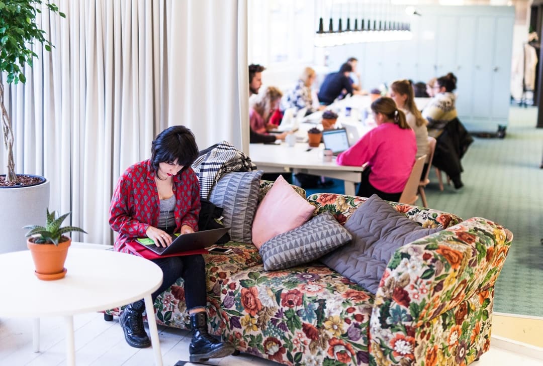 Mix of people co-working in open office