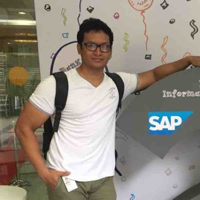 Profile picture of man wearing a white t-shirt and backpack