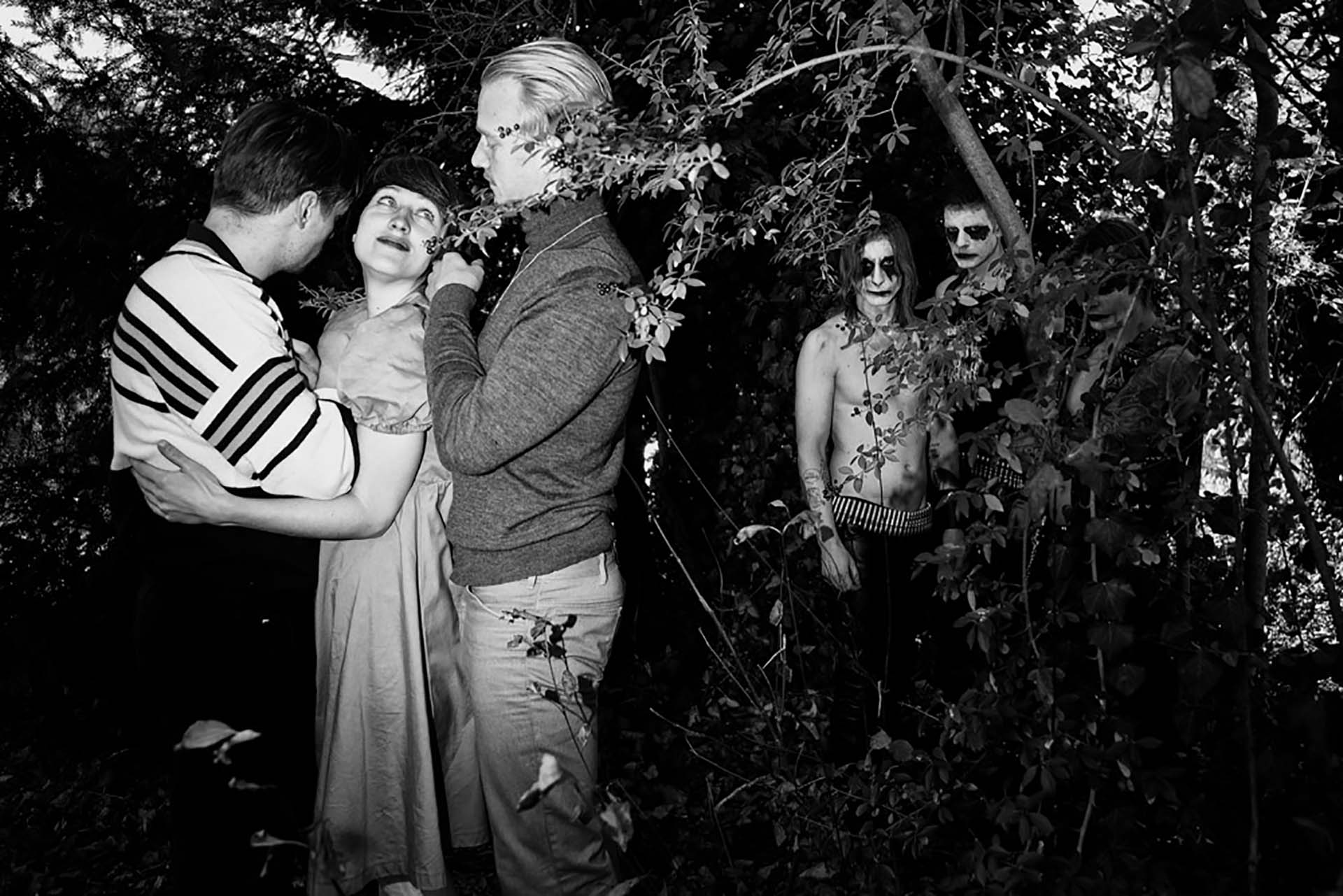 People in a forest hugging