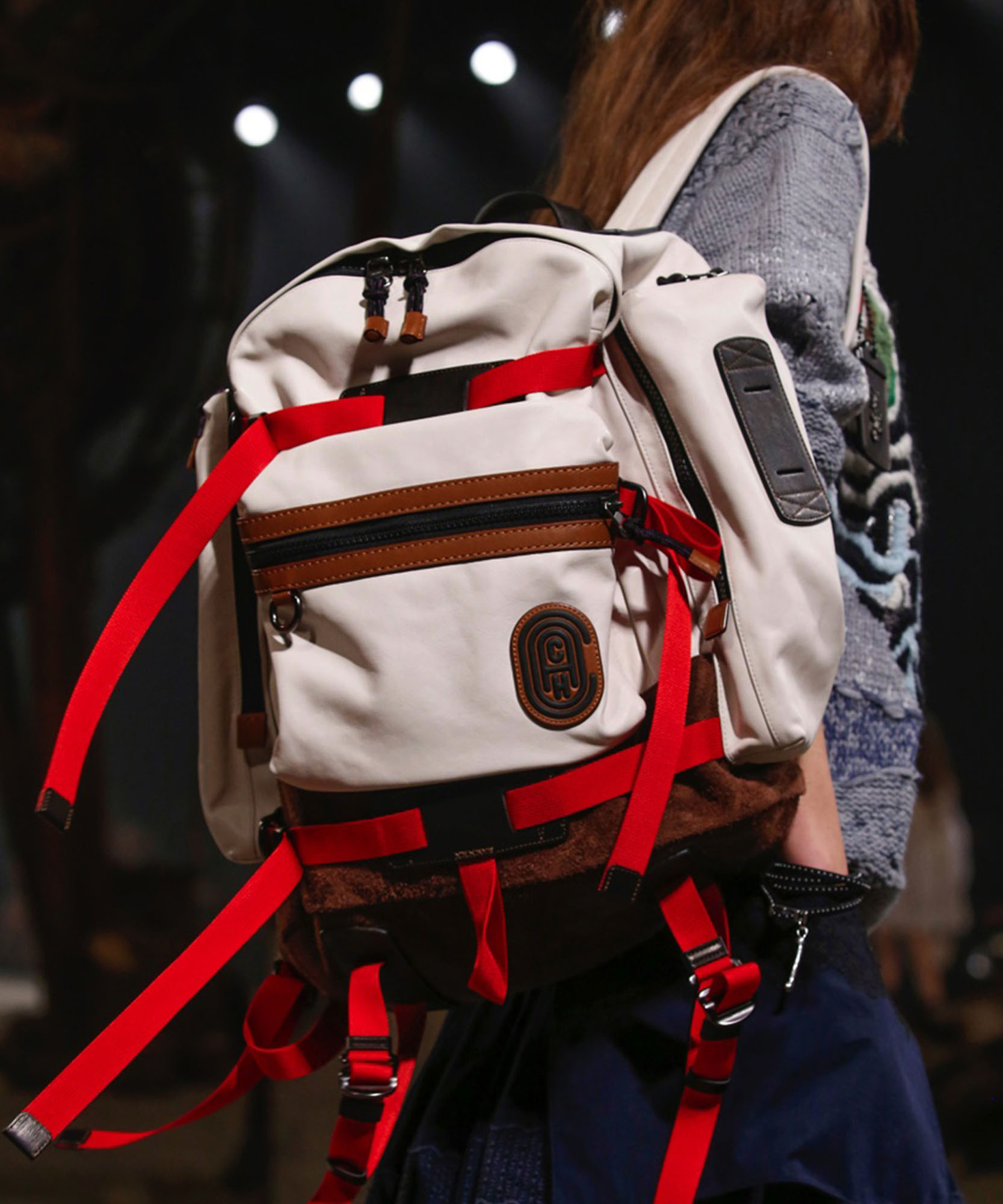 photo of model wearing a white backpack