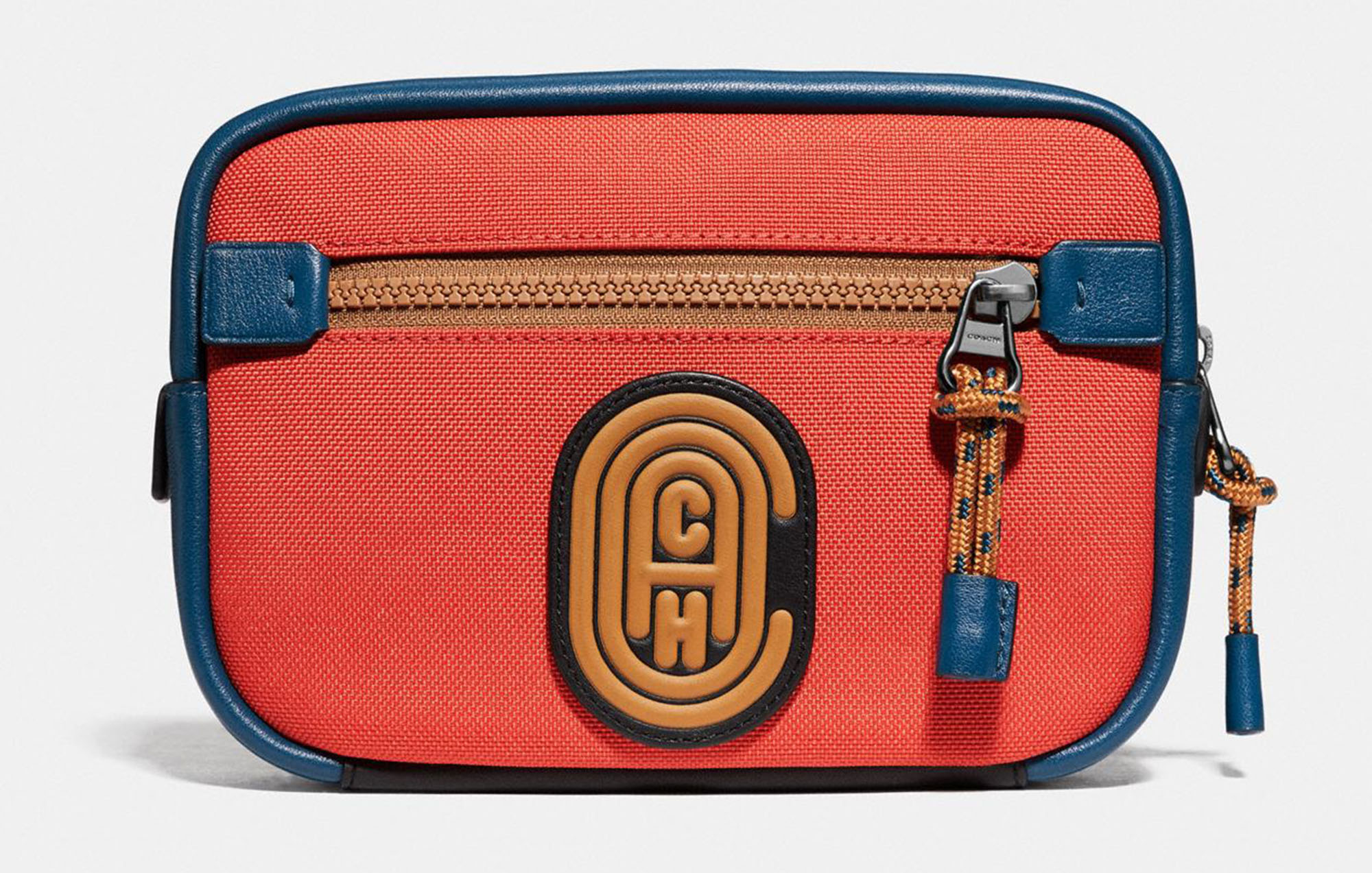 photo of small coin bag in red with coach logo