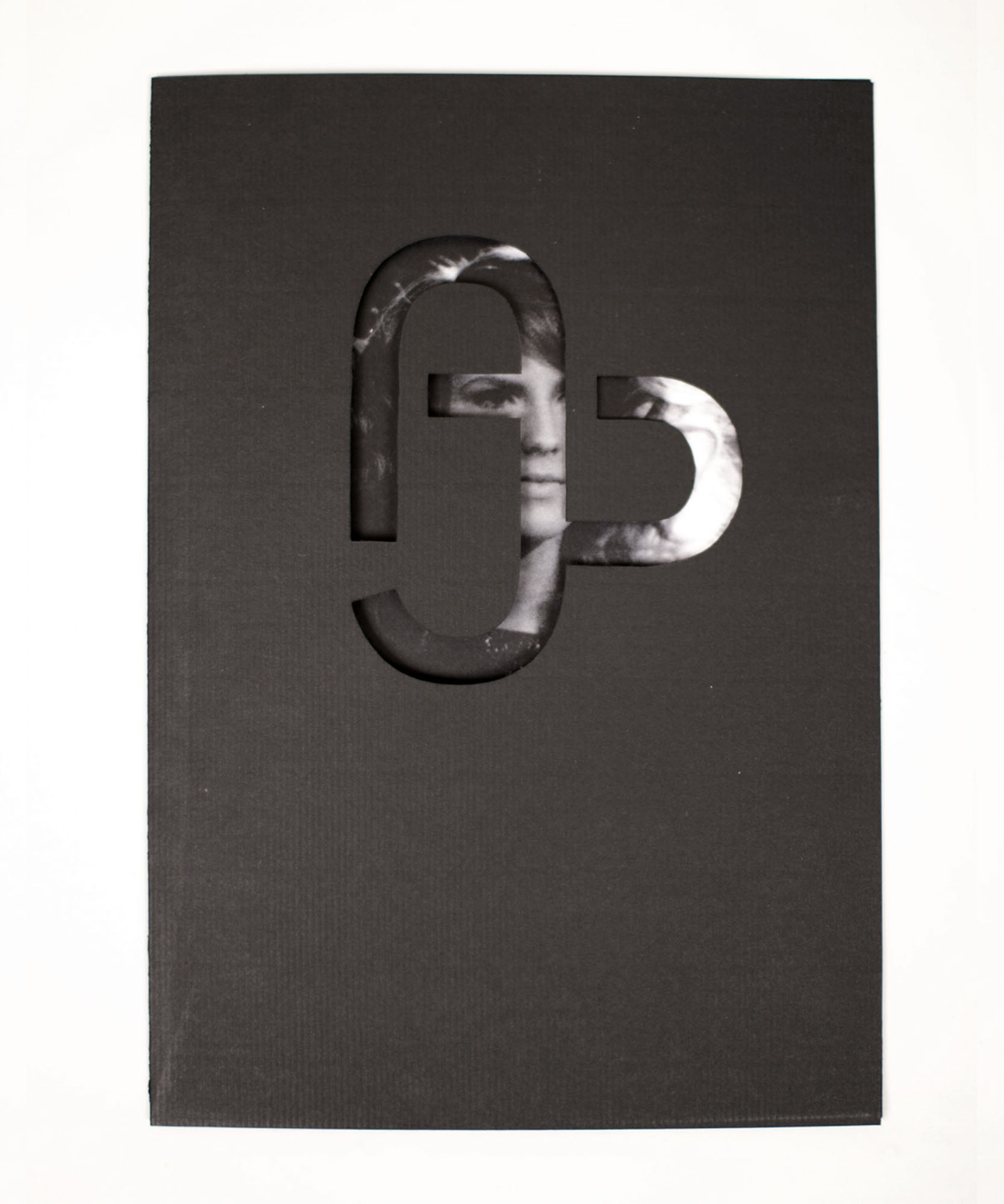 a black folder with azede logo cut out and a black background