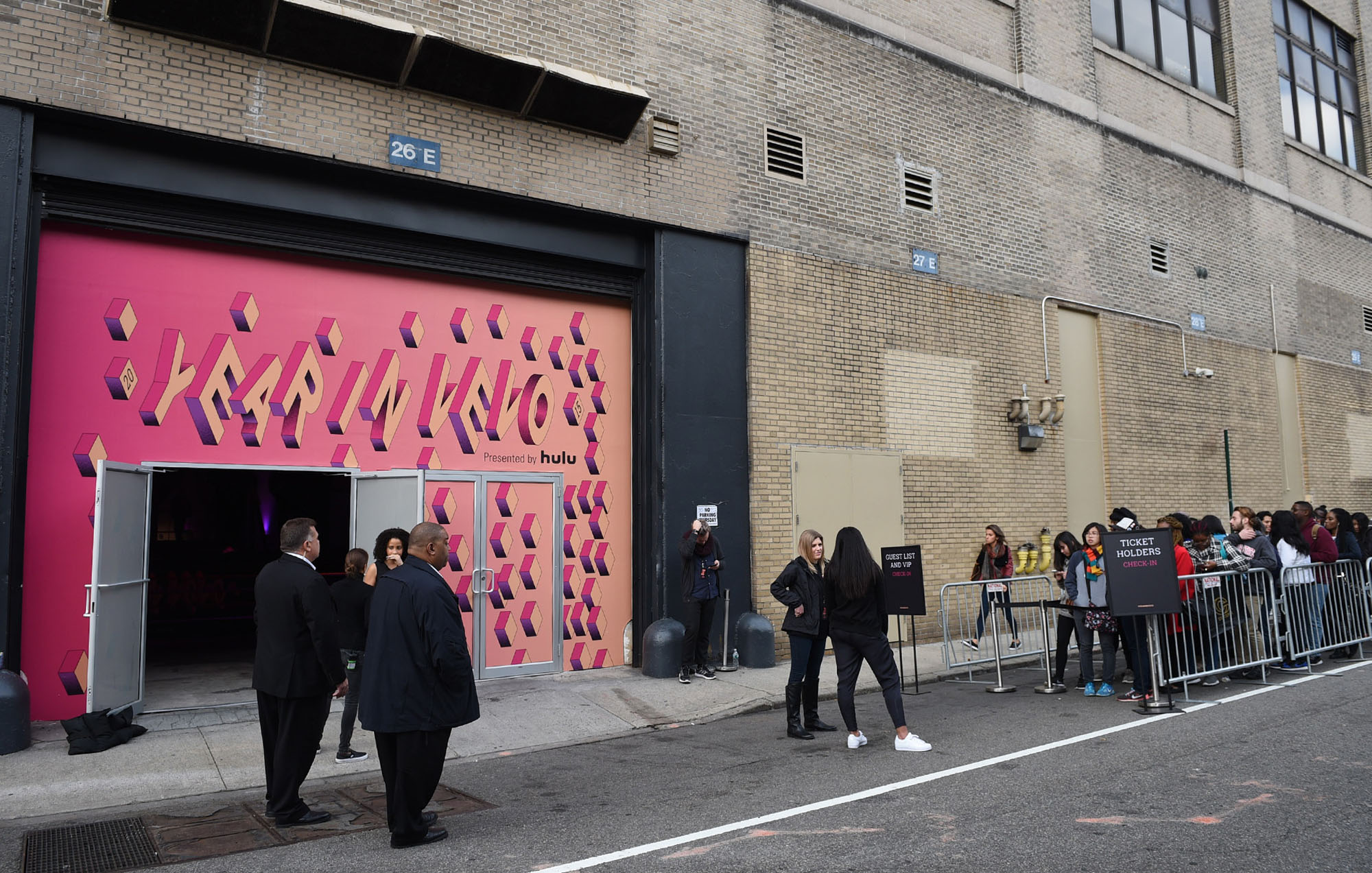 people waiting in line to get in the vevo in a year event with the vevo in a year logo outside the door