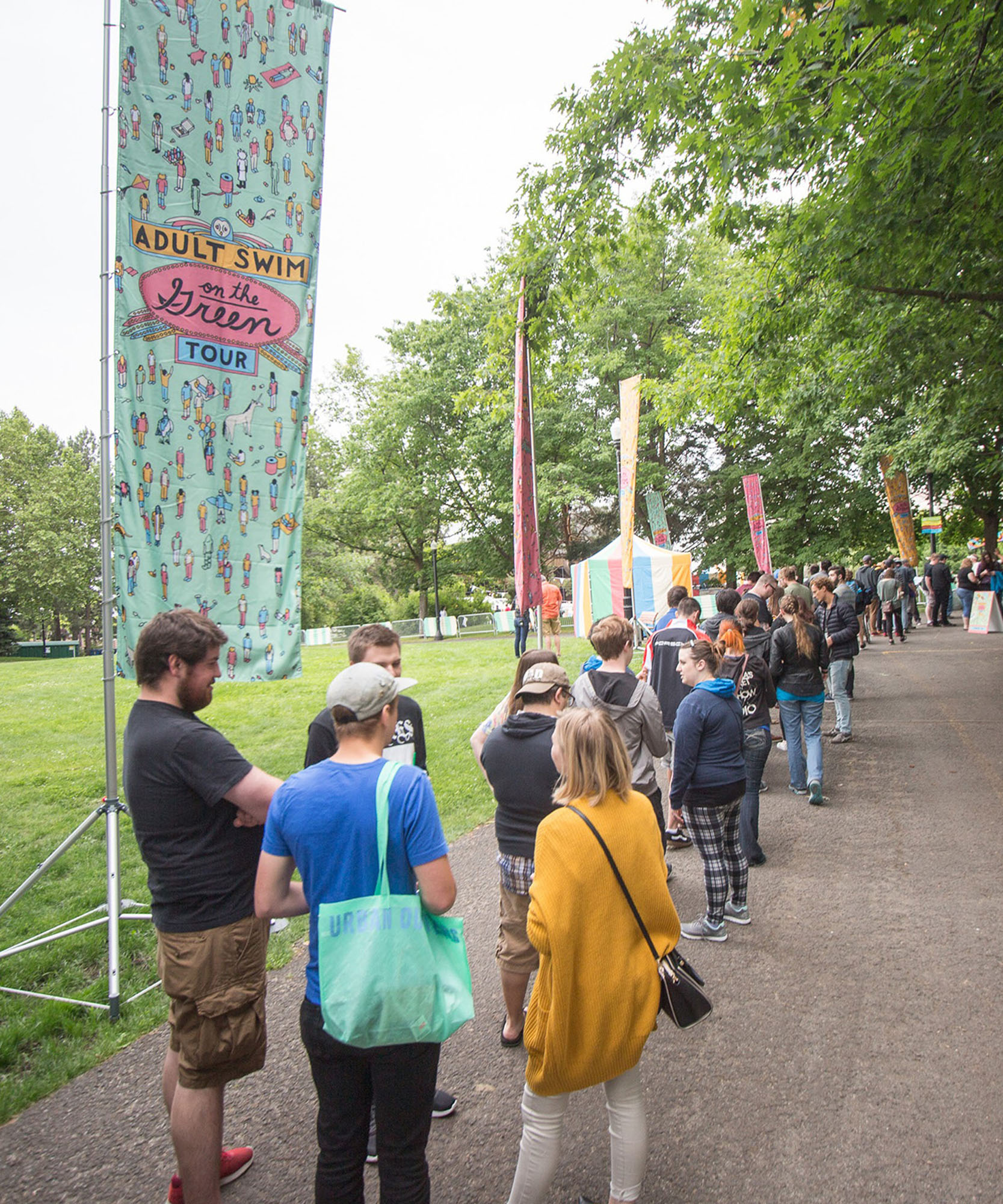 many people waiting in line in front of adult swim signs