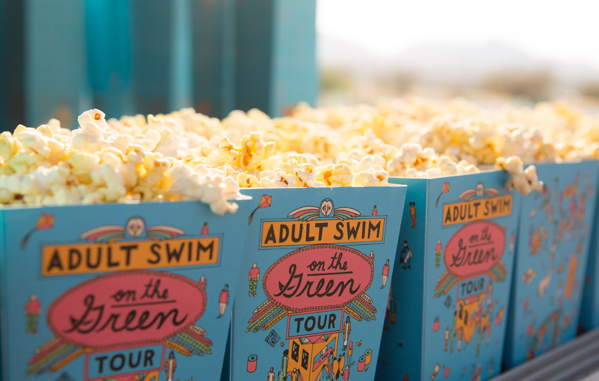 up close view of popcorn boxes with adult swim illustration on the front
