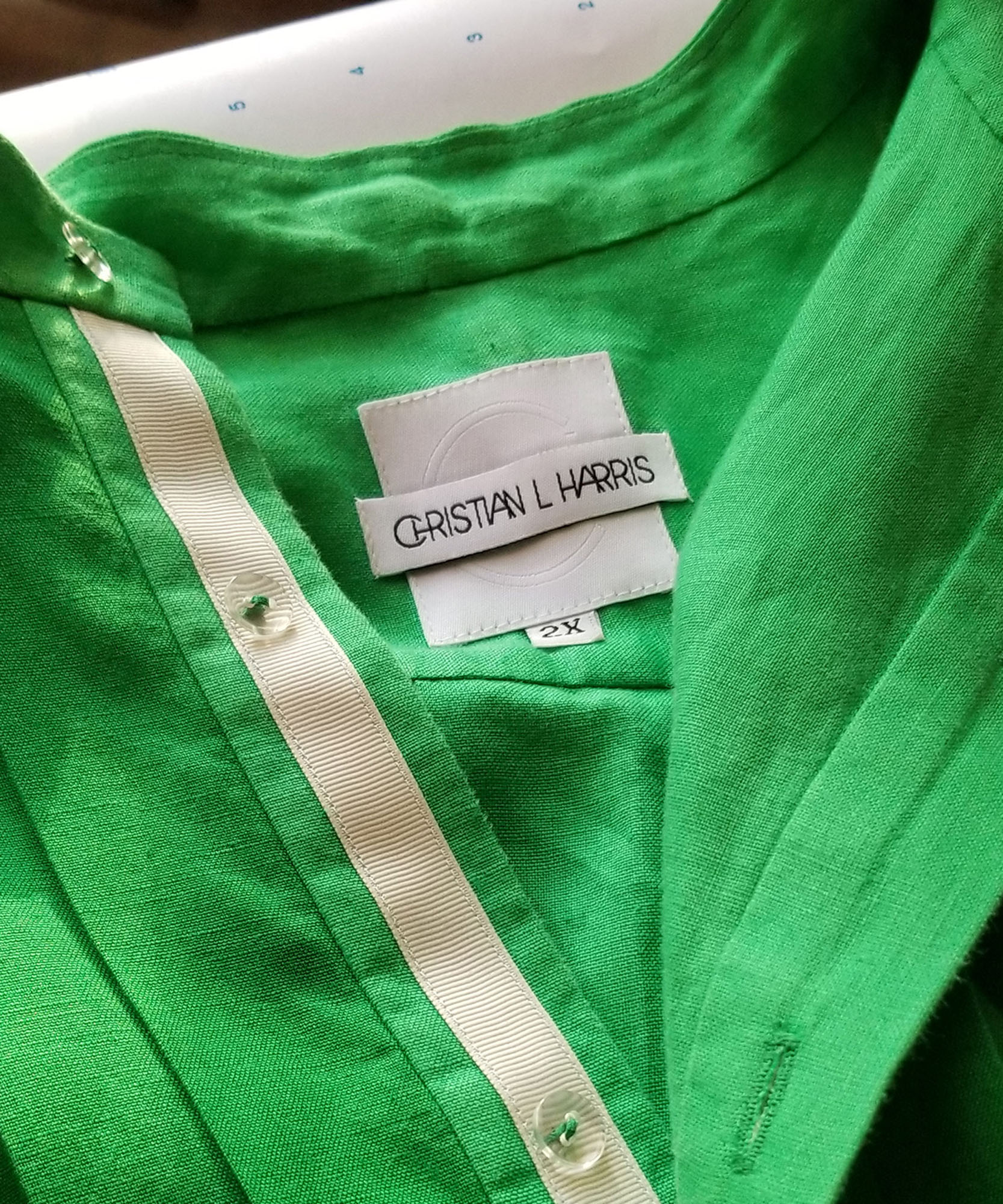 Christian L harris logo on tag inside green shirt