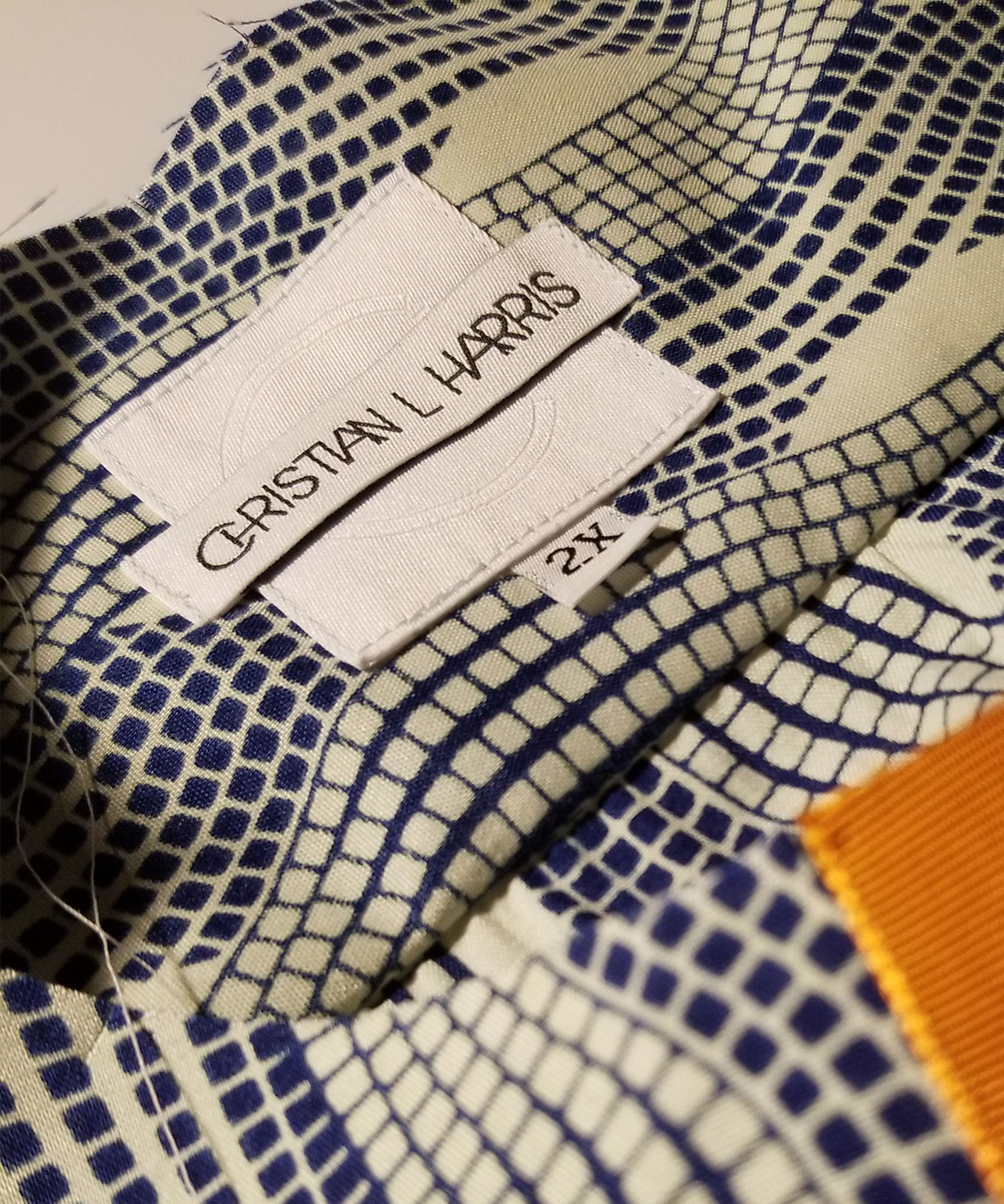 Christian L harris logo on tag inside blue and white shirt