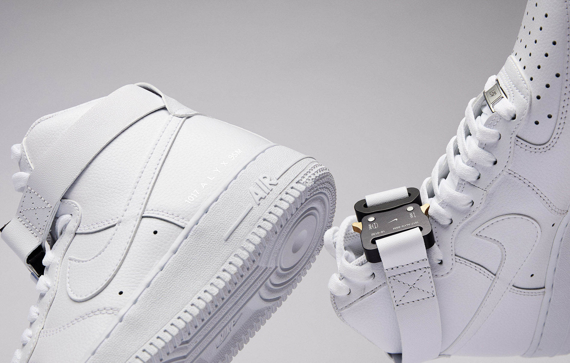 up close photo of white nike air force ones with a white background