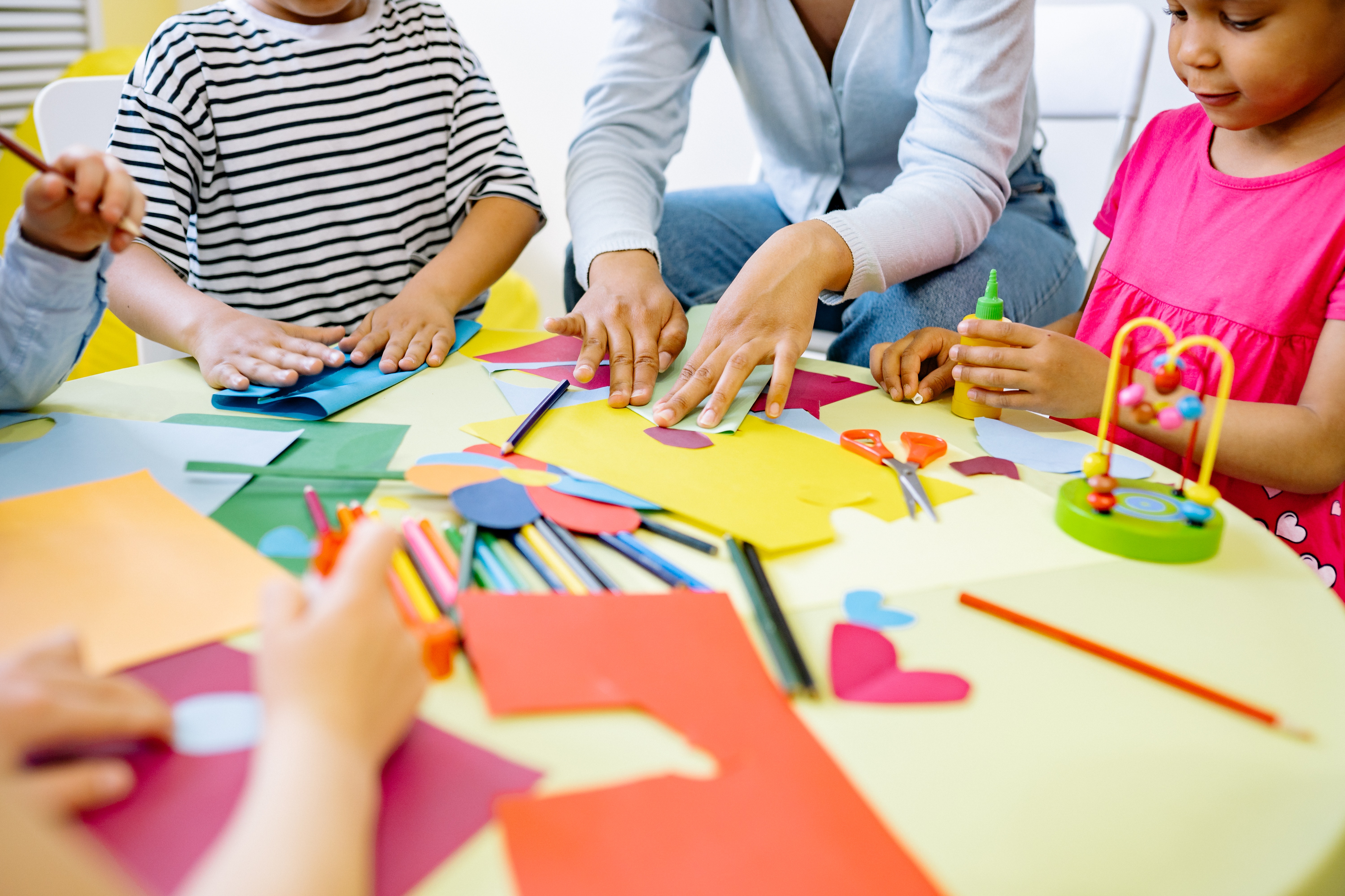 Students making art projects in a classroom makerspace.