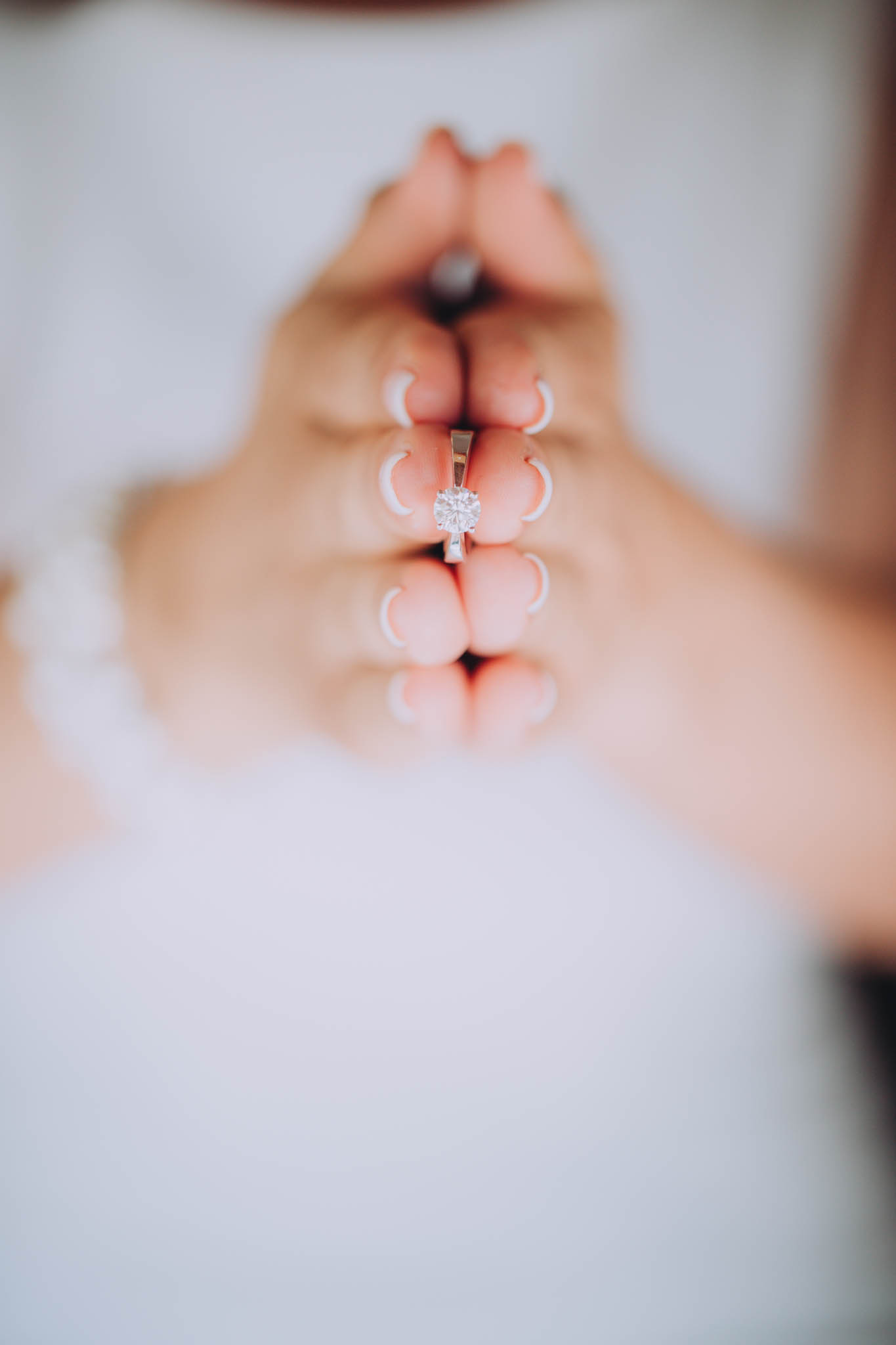 Louise Meyer Photography - hands holding a ring