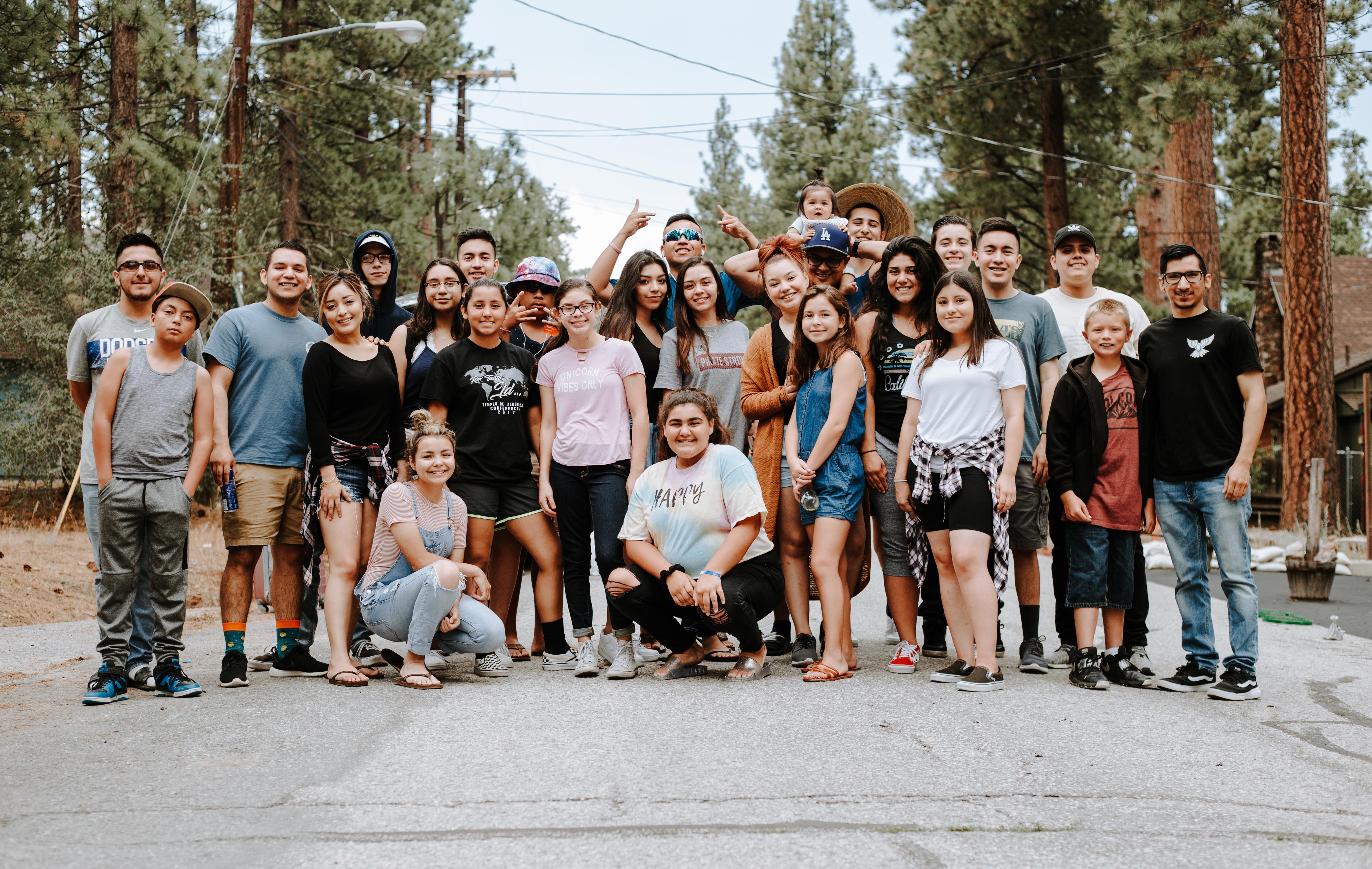 a huge group picture of about 30 people used to represent community