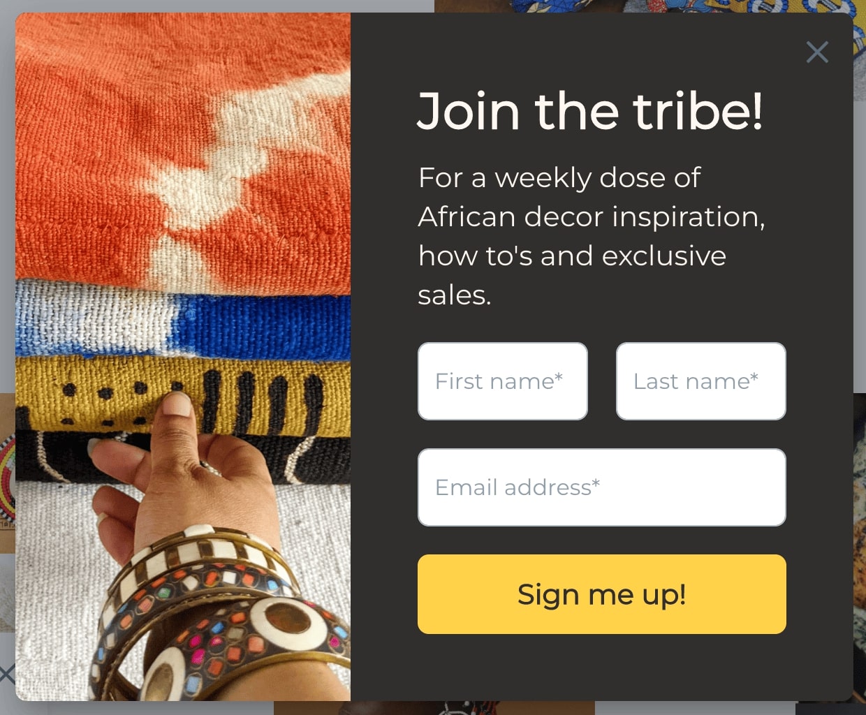 African-inspired pile of textiles, with the accompanying languge: Join the tribe! For a weekly dose of African decor inspiration, how to's and exclusive sales.