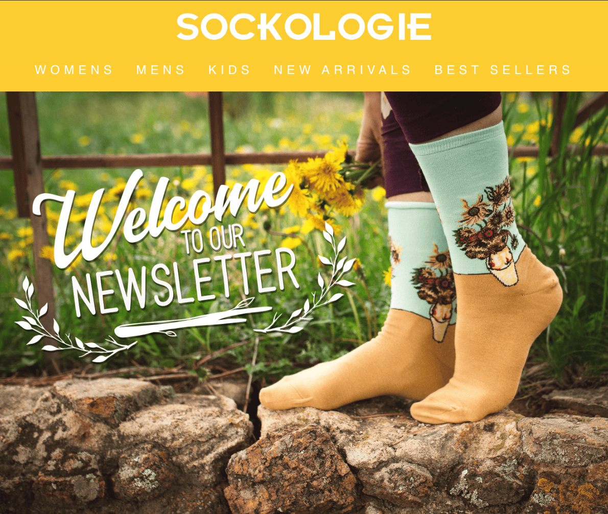 Top portion of a Sockologie welcome email, showing closeup of feet wearing socks, and accompanying text: Welcome to our newsletter